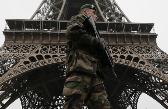 French soldier patrols near the Eiffel Tower in Paris as part of the highest level of "Vigipirate" security plan after a shooting at the Paris offices of Charlie Hebdo