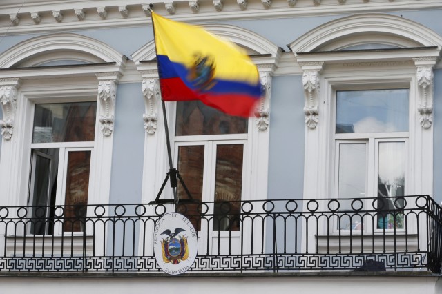 The national flag above the coat of arms is pictured at the embassy of Ecuador in Moscow