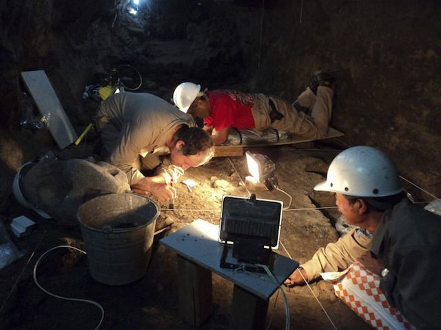 Handout photo INAH archaeologists working at a tunnel that may lead to a royal tombs discovered at the ancient city of Teotihuacan
