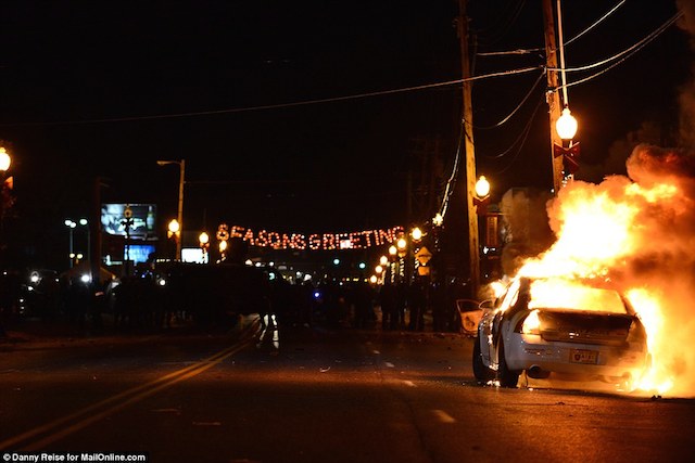 237B689800000578-2844491-Inferno_on_the_streets_At_the_Ferguson_Police_Department_in_Ferg-151_1416896402817
