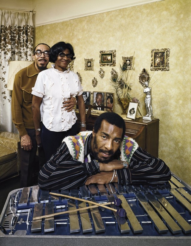 Folk singer Richie Havens leaning on xylophone w. parents (L-R): Richard and Mildred in bkgrd.