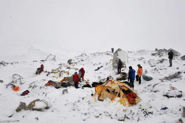 In this photograph taken on April 25, 2015, rescuers look for survivors after an avalanche that flattened parts of Everest Base Camp.   Rescuers in Nepal are searching frantically for survivors of a huge quake on April 25, that killed nearly 2,000, digging through rubble in the devastated capital Kathmandu and airlifting victims of an avalanche at Everest base camp.   AFP PHOTO/Roberto SCHMIDTROBERTO SCHMIDT/AFP/Getty Images