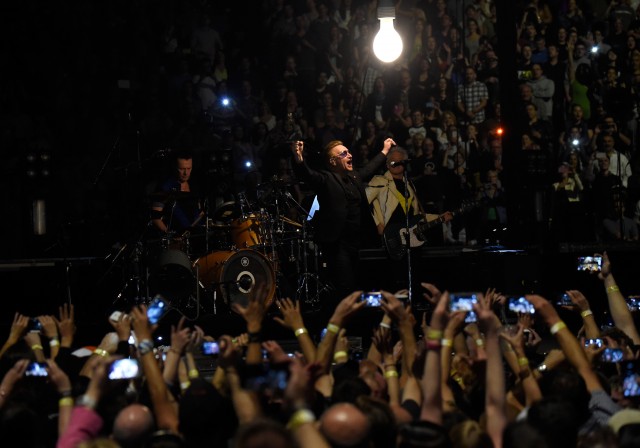 VANCOUVER, BC - MAY 14:  (L-R) Musicians Larry Mullen Jr., Bono and Adam Clayton of U2 perform onstage during the U2 iNNOCENCE + eXPERIENCE tour opener in Vancouver at Rogers Arena on May 14, 2015 in Vancouver, Canada.  (Photo by Kevin Mazur/WireImage) *** Local Caption *** Larry Mullen Jr.;Bono;Adam Clayton
