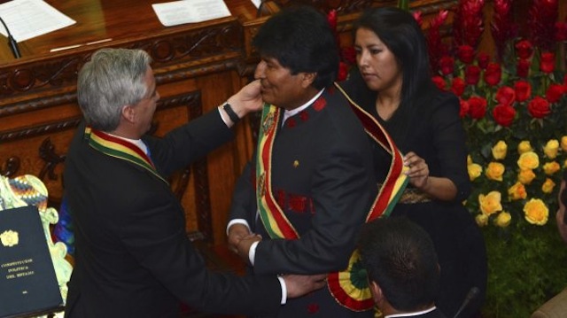 Vice President Linera places the presidential sash on Bolivia's President Morales at the Bolivian Congress building in La Paz