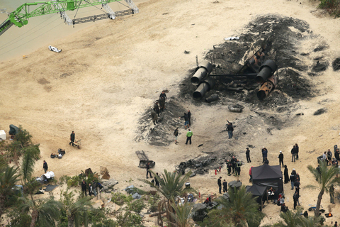 EXCLUSIVE: A burnt out ship and dead Storm Troopers can be seen during filming of Star Wars Rogue One.