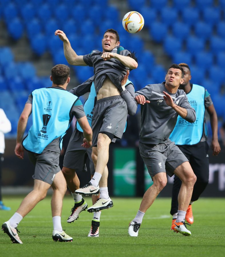BASEL, SWITZERLAND - MAY 17: James Milner of Liverpool wins a header with Dejan Lovren during a Liverpool training session on the eve of the UEFA Europa League Final against Sevilla at St. Jakob-Park on May 17, 2016 in Basel, Switzerland.  (Photo by Lars Baron/Getty Images)