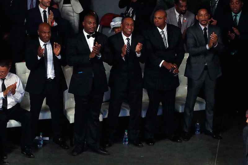 LOUISVILLE, KY - JUNE 10: Pallbearers including Will Smith at right, Mike Tyson at left, and Lennox Lewis, second from left, look on during a memorial service for boxing legend Muhammad Ali on June 10, 2016 at the KFC Yum! Center in Louisville, Kentucky. Ali died June 3 of complications from Parkinson's disease. (Photo by Aaron P. Bernstein/Getty Images)