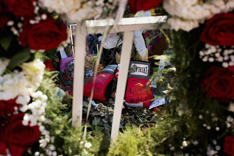 LOUISVILLE, KY - JUNE 10: A pair of boxing gloves are placed on a memorial at the Muhammad Ali Center on June 10, 2016 in Louisville, Kentucky. After the funeral and the eulogy, people reconvened at the Muhammed Ali Center to celebrate the life of the iconic sports figure. (Photo by Ty Wright/Getty Images)