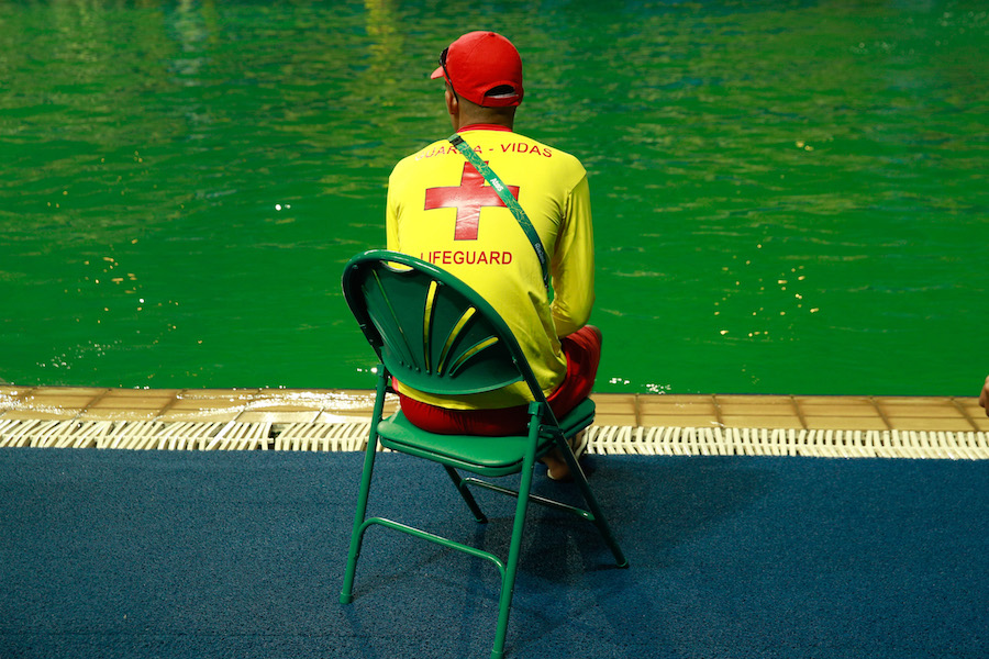 RIO DE JANEIRO, BRAZIL - AUGUST 09: A lifeguard sits by the edge of the diving pool at Maria Lenk Aquatics Centre on Day 4 of the Rio 2016 Olympic Games at Maria Lenk Aquatics Centre on August 9, 2016 in Rio de Janeiro, Brazil. (Photo by Adam Pretty/Getty Images)