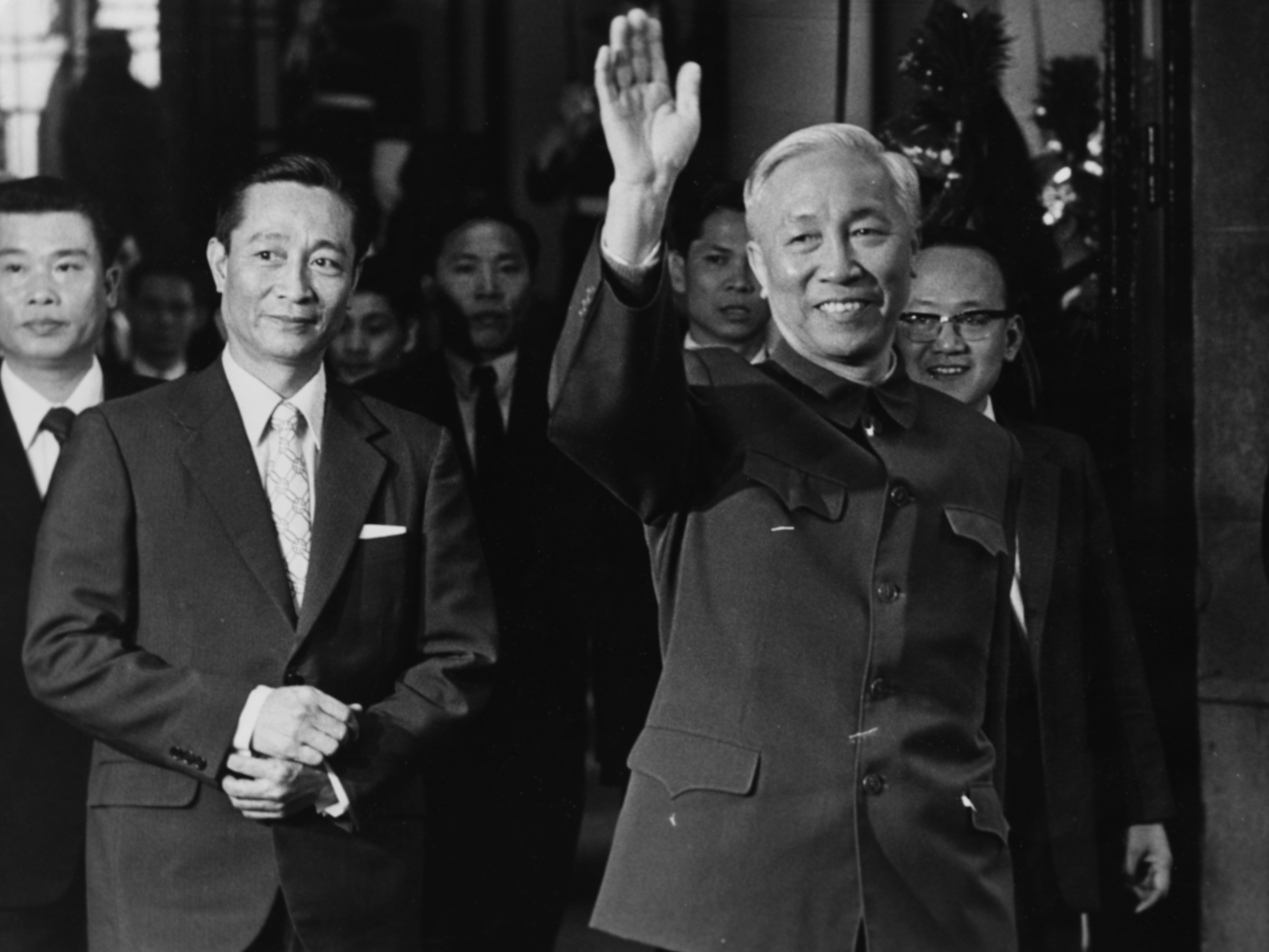 Vietnamese politician Le Duc Tho waving to photographers as he arrives at a conference in Paris, circa 1970. (Photo by Keystone/Hulton Archive/Getty Images)