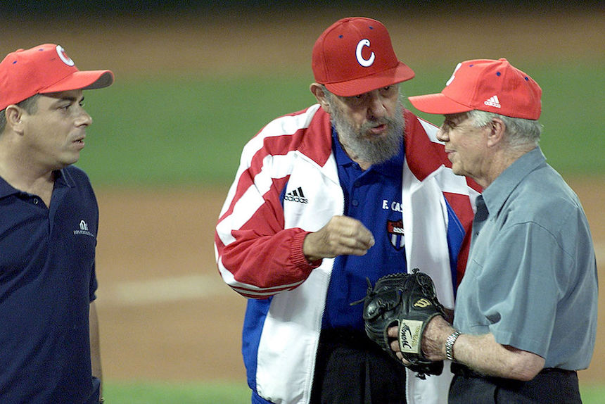 405366 01: Former U.S. President Jimmy Carter (R) and Cuban President Fidel Castro (C) talk after a friendly game of baseball at the Latinoamericano Stadium May 14, 2002 in Havana, Cuba. This is the first visit by a former or sitting U.S. President since Castro came to power in 1959. (Photo by Jorge Rey/Getty Images)