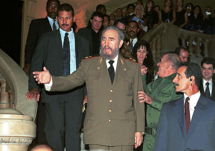 380627 01: Cuban President Fidel Castro, center, attends the opening of the 17th Havana International Festival of Ballet, October 20, 2000 at the Grand Theatre in Havana, Cuba. (Photo by Jorge Rey/Newsmakers)
