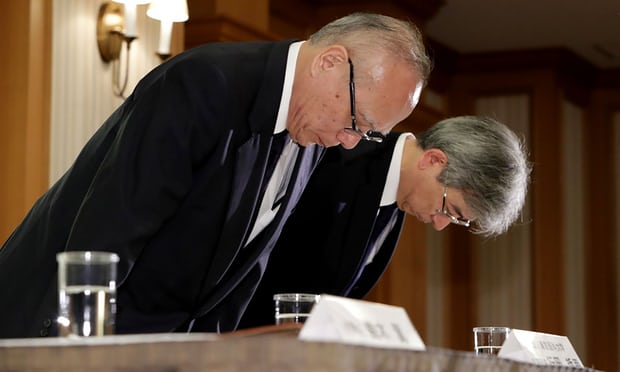 Managing director of Tokyo Medical University, Tetsuo Yukioka and vice-president Keisuke Miyazawa bow as they attend a press conference in Tokyo