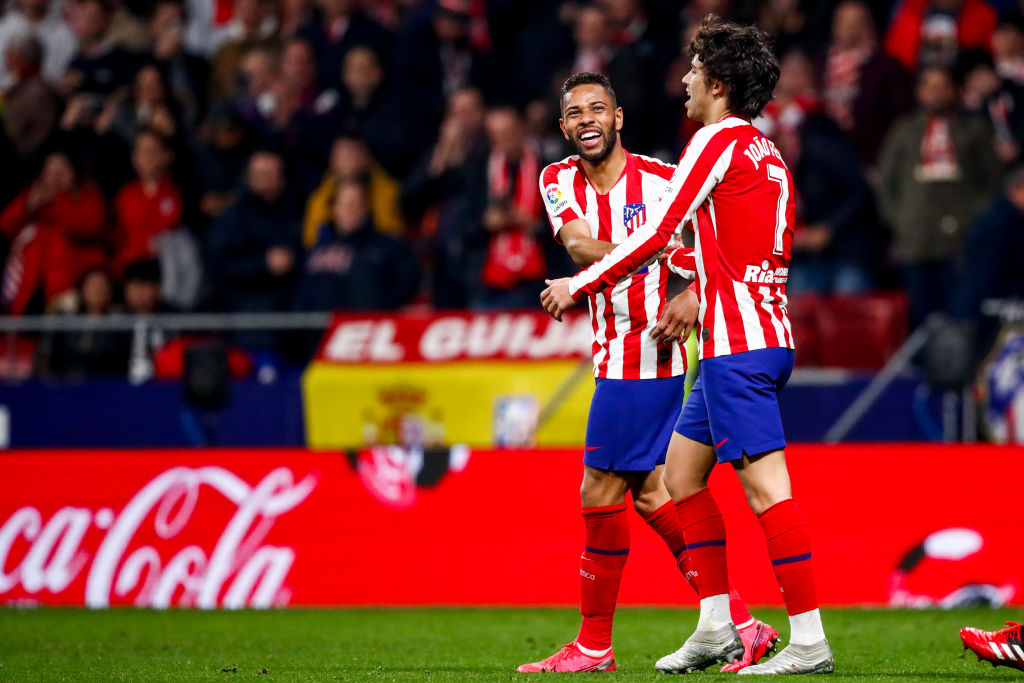 Joao Félix y Renan Lodi celebran