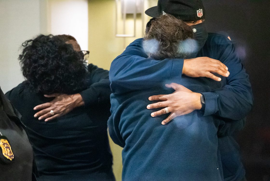 People hug after learning that their loved one is safe after a person shot and killed 8 people inside a FedEx building Friday, April 16, 2021.Fedex Mass Shooting Indianapolis Indystar