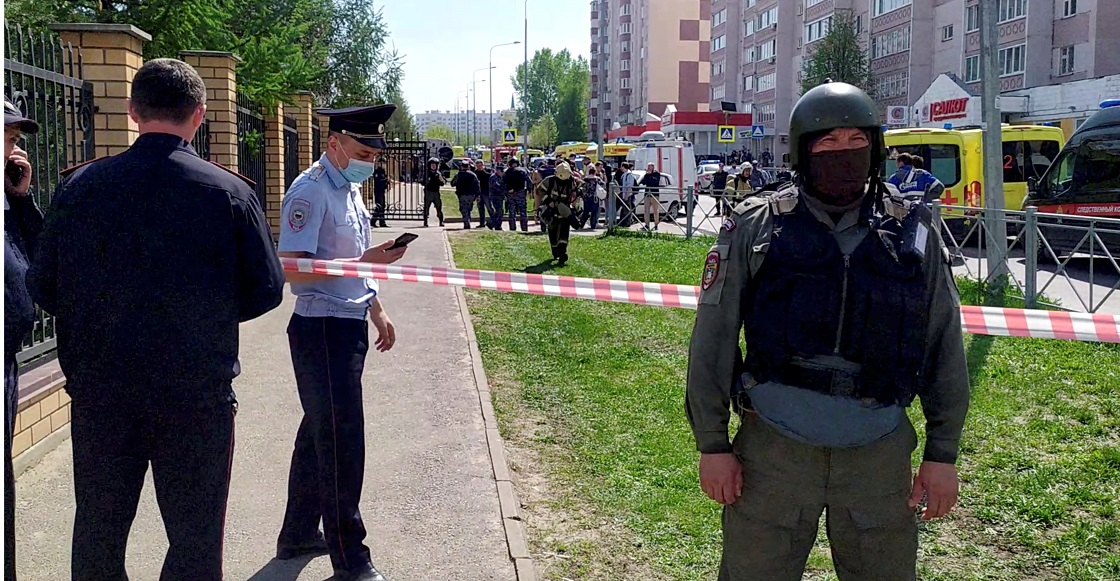 Law enforcement officers work outside School Number 175 following a recent shooting in Kazan, Russia May 11, 2021, in this screen grab taken from video. Reuters TV via