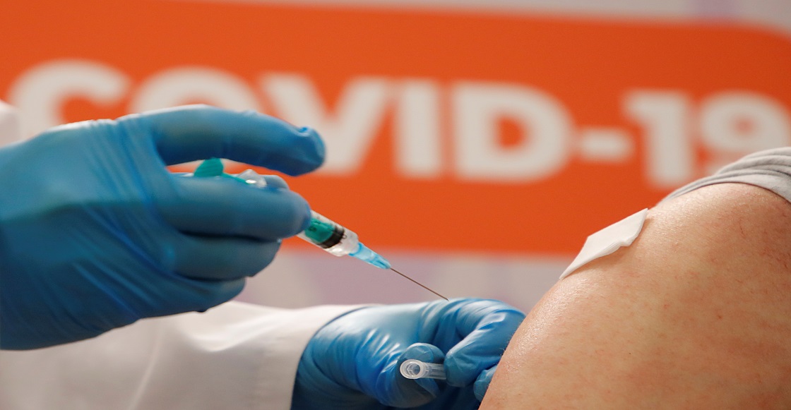 FILE PHOTO: A person receives a dose of Sputnik V (Gam-COVID-Vac) vaccine against the coronavirus disease (COVID-19) at a vaccination centre in a shopping mall in Saint Petersburg, Russia February 24, 2021.