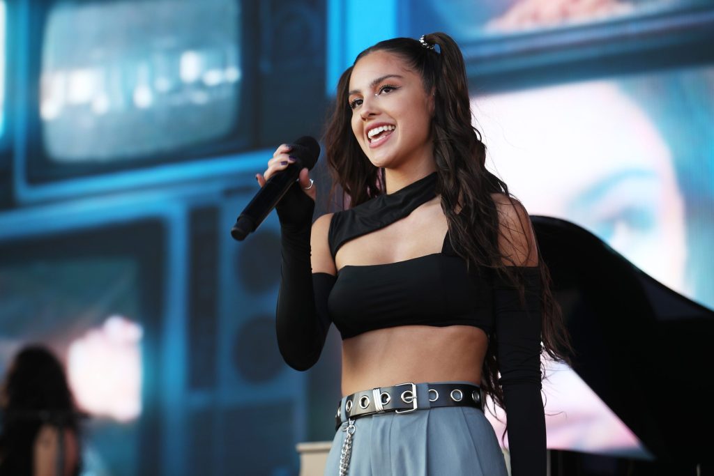 Two young people caught hold of each other in the middle of Olivia Rodrigo's concert