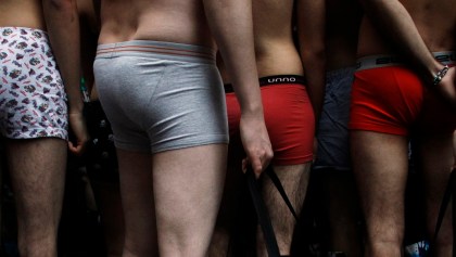 People in their underwear wait to get clothes for free outside a clothing store in Madrid January 2, 2011. A clothing brand marked the start of sales in Madrid by offering the first 100 customers clothes for free as long as they showed up in their underwear.