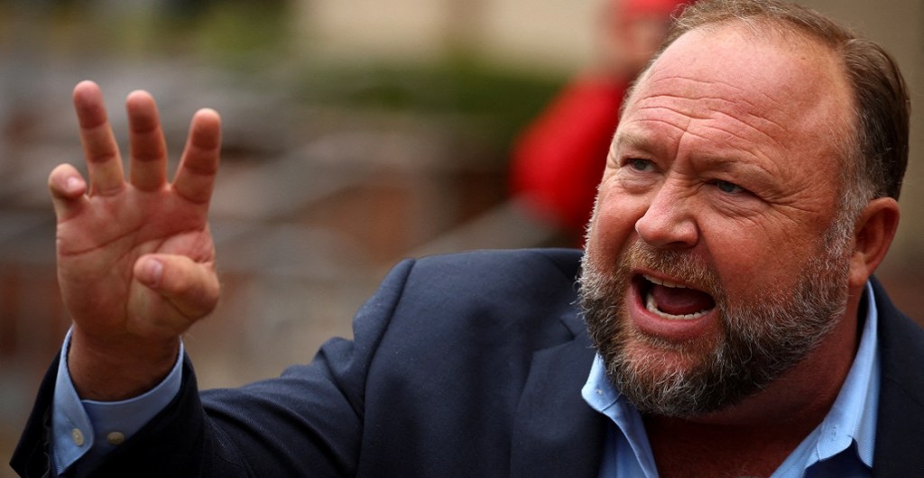 FILE PHOTO: Infowars founder Alex Jones speaks to the media after appearing at his Sandy Hook defamation trial at Connecticut Superior Court in Waterbury, Connecticut, U.S., October 4, 2022.