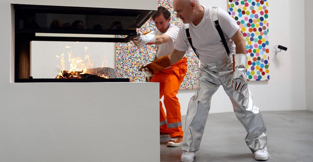 British artist Damien Hirst takes part in a burn event which is part of his latest NFT exhibition "The Currency", in London, Britain, October 11, 2022. 
